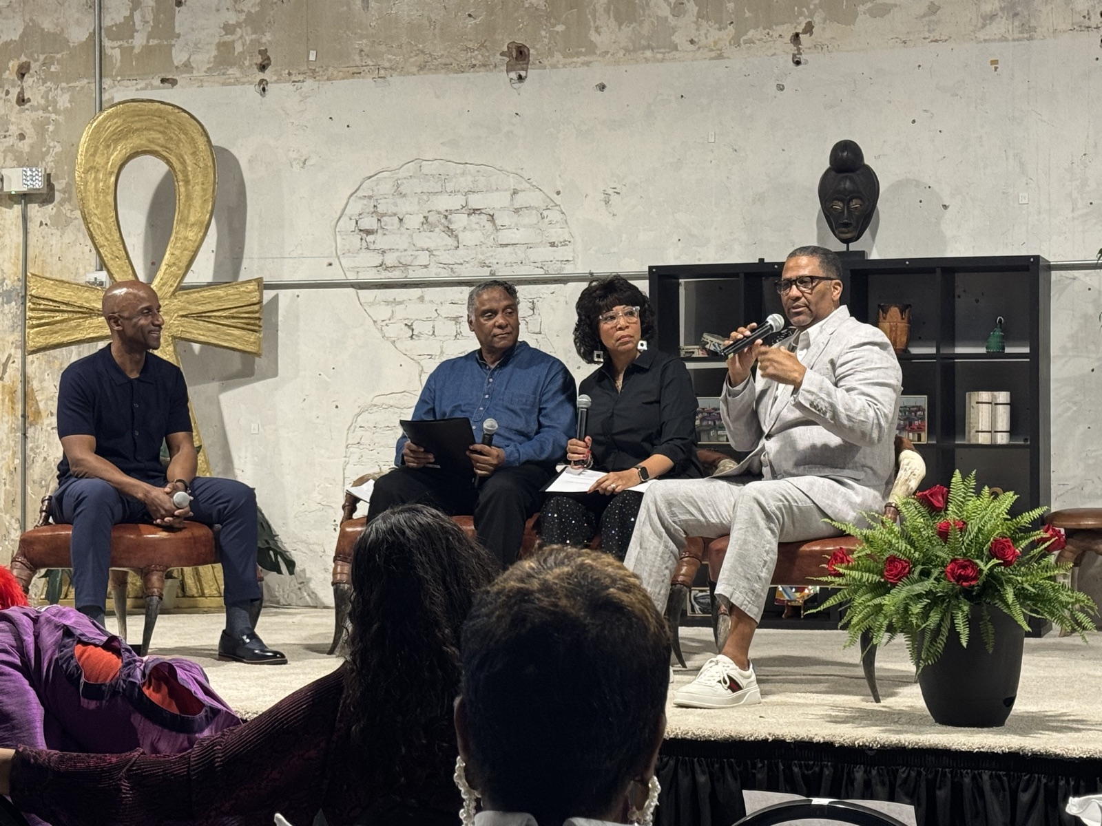 Panelists in a Green Book Comedy Tour fireside chat on stage.