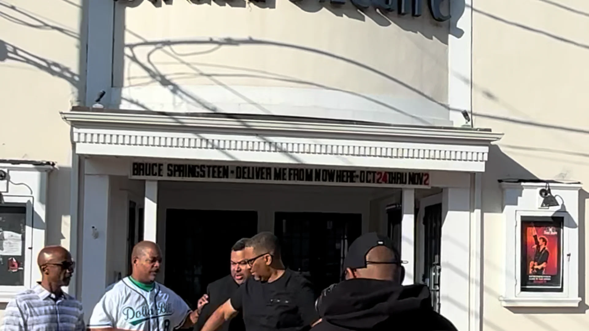 Still from the Green Book Comedy Tour movie screening video, outside a theater.